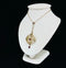 An antique target style pendant showcasing exquisite craftsmanship from the Edwardian era.