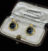 Pair of Antique Victorian 18ct yellow gold snake earrings with 8mm banded onyx cabochons, front view in antique velvet box.