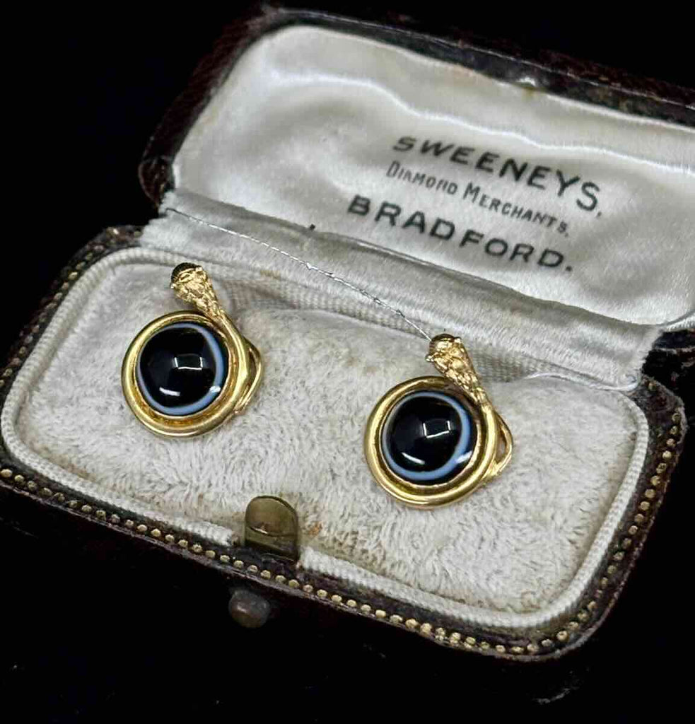 Pair of Antique Victorian 18ct yellow gold snake earrings with 8mm banded onyx cabochons, front view in antique velvet box.