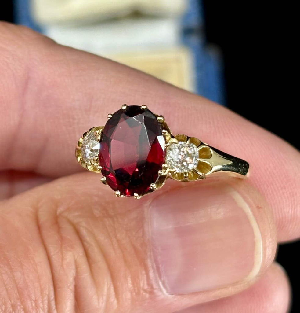 The side setting up close of the antique Victorian yellow gold diamond trilogy ring.