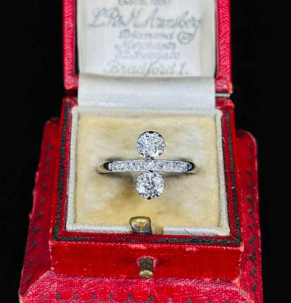 Two stone Old European cut diamond ring circa 1920s claw set in platinum with pavé single cut diamonds and 18ct white gold lower shank.