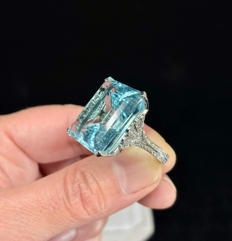 Aquamarine and round brilliant cut diamond engagement ring in platinum