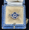 art deco sapphire and diamond round cluster ring in blue vintage ring box.