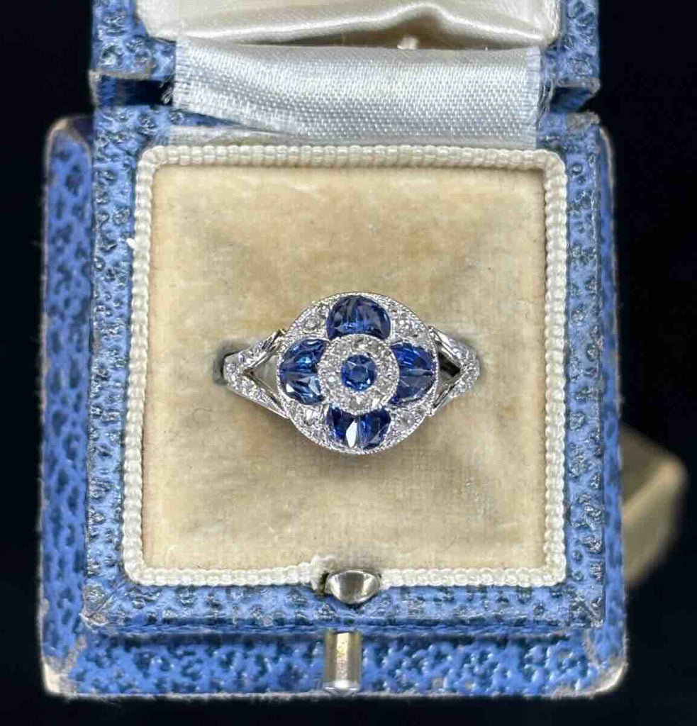 art deco sapphire and diamond round cluster ring in blue vintage ring box.