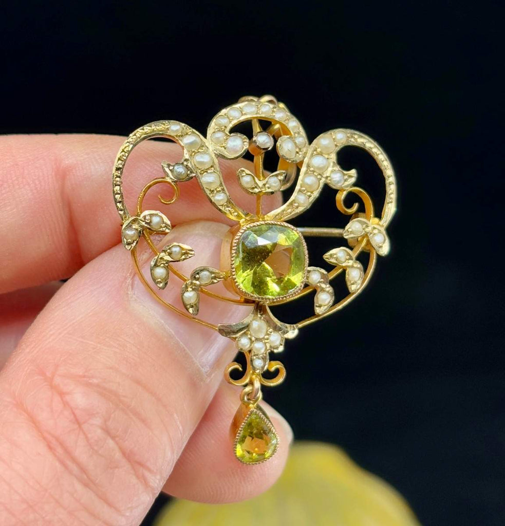 Antique Art Nouveau 9ct gold garnet and pearl pendant brooch with green centre stone and pearl set scroll design, circa 1917–1931.