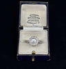 Australian antique pearl and diamond cluster ring, near‑round natural pearl surrounded by early modern diamonds.
