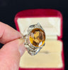 Gum leafs surround this collectible piece of wearable art made in the 1930s by jewellery designer Rhoda Wager