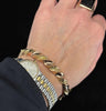 Australian Colonial Willis & Co repoussé hinged bangle in 9ct yellow gold, Edwardian era circa 1905 — wearable heirloom and collectible jewellery photographed on the arm.