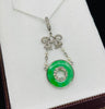 Collectible A‑type jadeite pendant — untreated jade pi disc in a Belle Époque platinum setting, ideal investment piece
