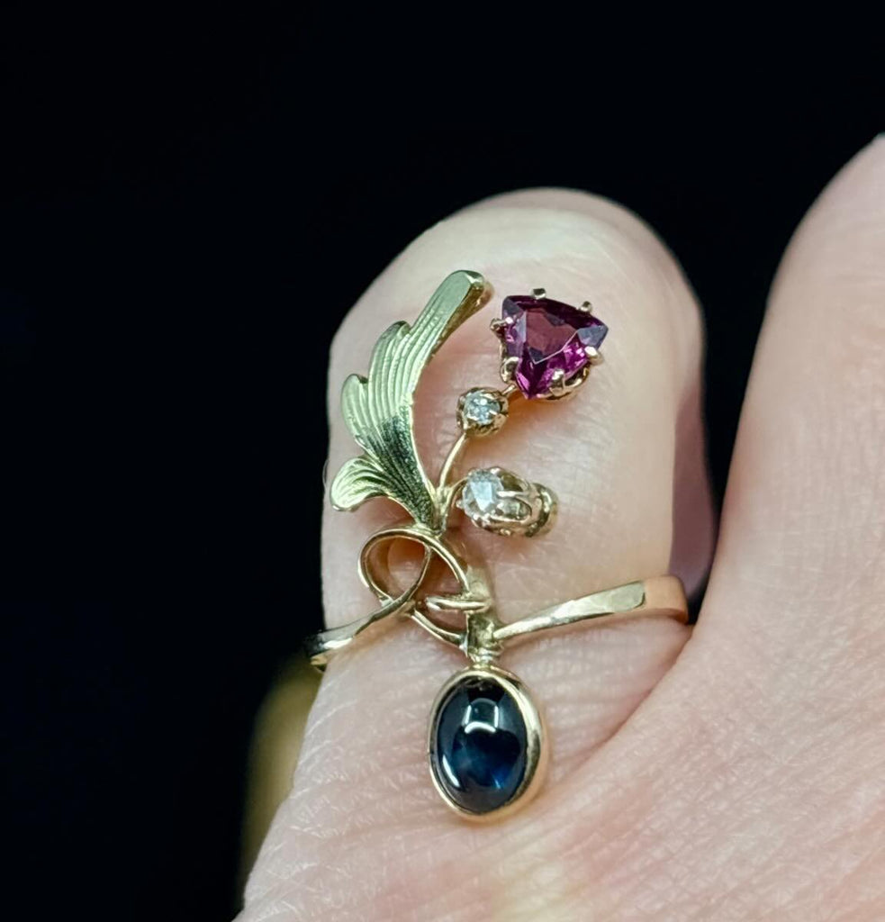 Collectible Russian Art Nouveau sapphire, garnet and diamond ring with graceful engraved leaves and original 56 zolotnik mark.