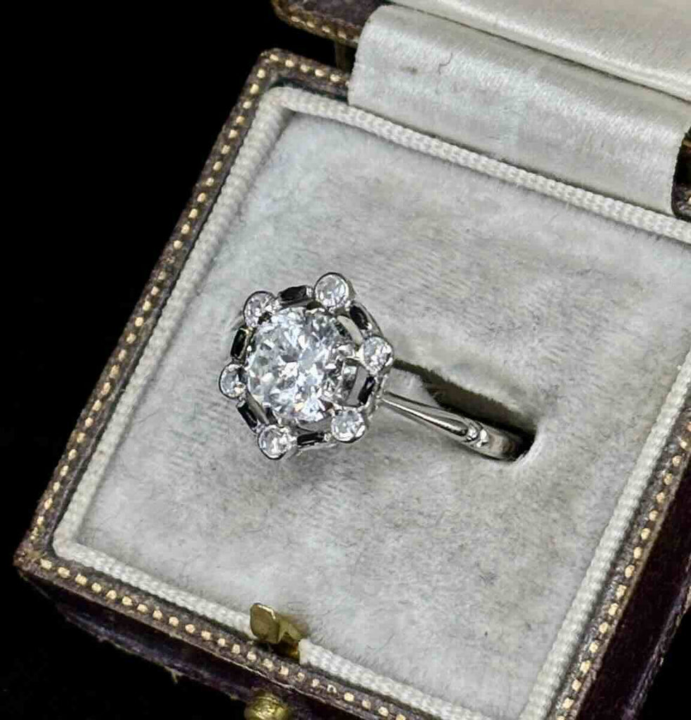 Early round brilliant-cut diamond ring set in platinum and 18ct white gold.