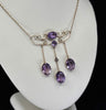 Edwardian amethyst necklace in 9ct yellow gold, featuring claw-set oval amethysts and a delicate fine link chain, representing Australian jewellery history.