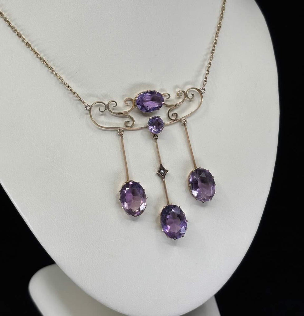 Edwardian amethyst necklace in 9ct yellow gold, featuring claw-set oval amethysts and a delicate fine link chain, representing Australian jewellery history.