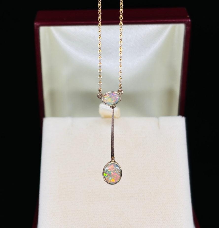 Antique Edwardian opal necklace featuring stunning Lightning Ridge opals set in 9ct yellow gold, showcasing vibrant colors and intricate design.