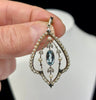 Edwardian Art Nouveau aquamarine pendant (circa 1905) with central oval aquamarine, seed pearls and rose & mine‑cut diamonds in platinum and 15ct gold.