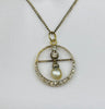 Antique Edwardian natural pearl and diamond pendant featuring a 7.5mm pearl and 29 dazzling diamonds, set in platinum and yellow gold.