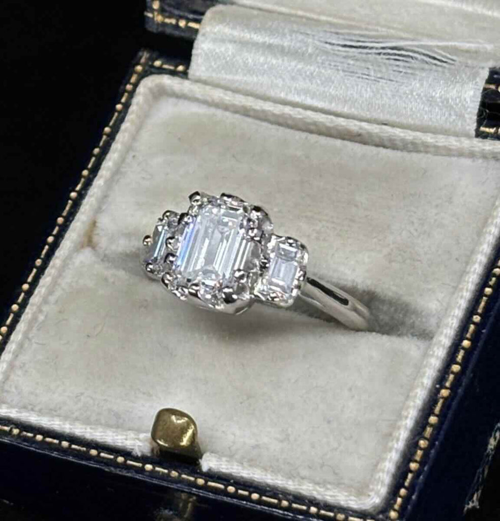 GIA certified 1.51ct emerald cut engagement ring in platinum, E colour VS2, Art Deco baguette side stones
