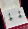 Modern emerald and diamond earrings in 9ct yellow gold.