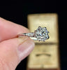 Fine craftsmanship of an old mine cut diamond ring with a harmonious and captivating design.