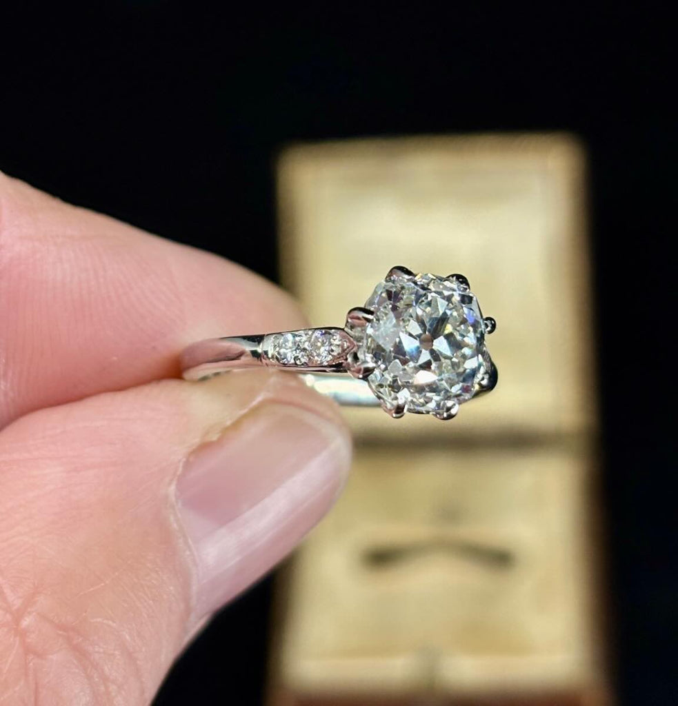 Fine craftsmanship of an old mine cut diamond ring with a harmonious and captivating design.