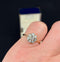 Historical antique jewellery piece, a daisy cluster ring with old cut diamonds, circa 1915.