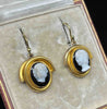 Victorian 15ct yellow gold hardstone cameo drop earrings with hand-carved white maiden profiles on black agate.
