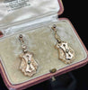Pair of Victorian 9ct rose gold drop earrings with hand-engraved shield-shaped plaques and natural seed pearl accents.