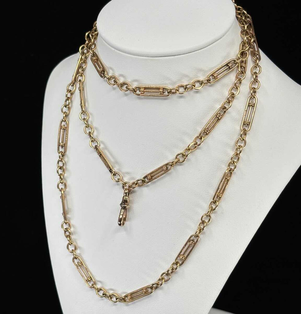Long 84cm Edwardian 9ct yellow gold guard chain in mint condition, detailed view of links and craftsmanship ideal for collectors and fashion.