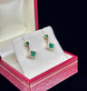 Luxury emerald and diamond earrings for stylish women.