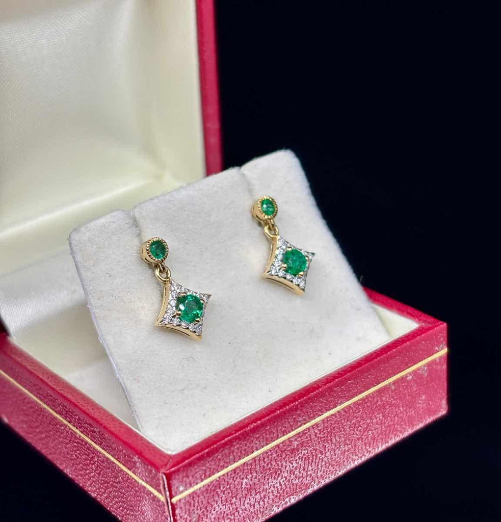 Luxury emerald and diamond earrings for stylish women.