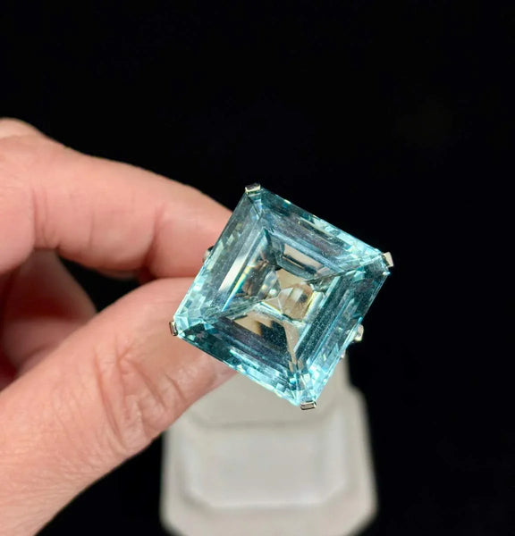 Handcrafted platinum ring featuring vibrant aquamarine and 108 diamonds