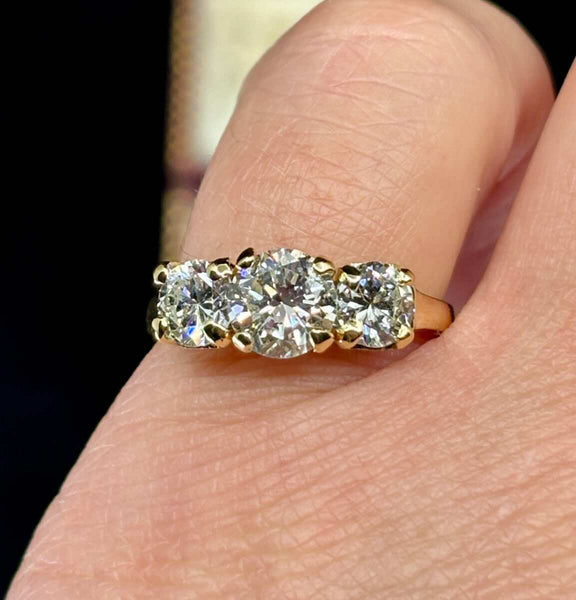 Mid-century 1960s claw-set diamond trilogy ring.