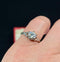 Mid-century design of a 1950s diamond engagement ring in mixed metals.