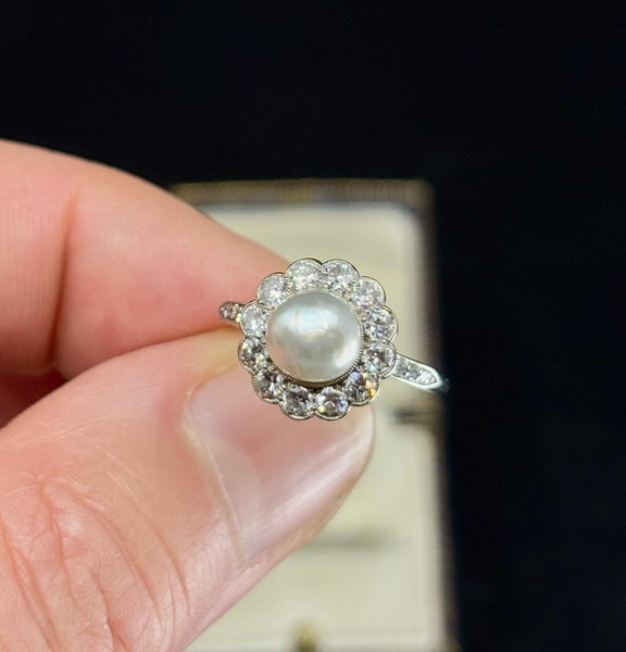 Natural near‑round pearl cluster ring by Hardy Brothers, platinum setting with F‑G VS diamonds, ideal heirloom.