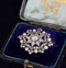 Floral design of an antique Victorian brooch featuring old mine cut and rose cut diamonds.