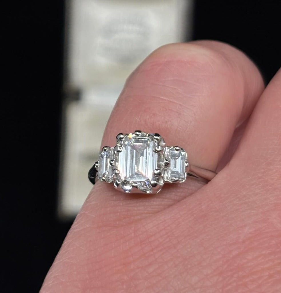 Platinum Art Deco emerald cut ring 1.51ct (GIA), E colour VS2 with tapered baguette shoulders — classic engagement ring worn on the finger