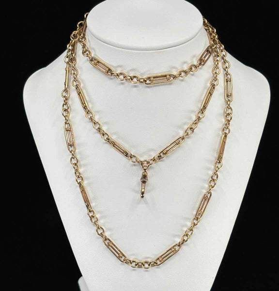 Rare Edwardian guard chain in 9ct yellow gold, 84cm long, close-up of the distinctive rare link and swivel clip in excellent original condition.
