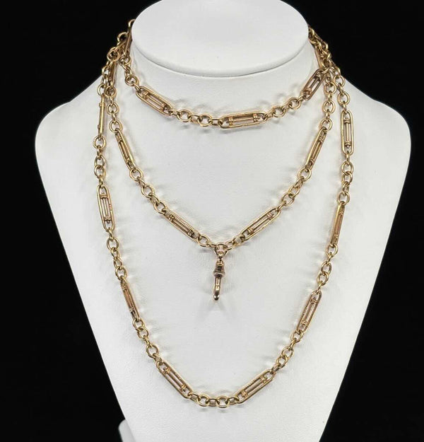 Rare Edwardian guard chain in 9ct yellow gold, 84cm long, close-up of the distinctive rare link and swivel clip in excellent original condition.