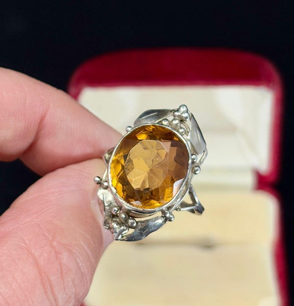 A stunning round 11.00ct oval citrine highlights the magnificent ring made by Australian jewellery designer, Rhoda Wager