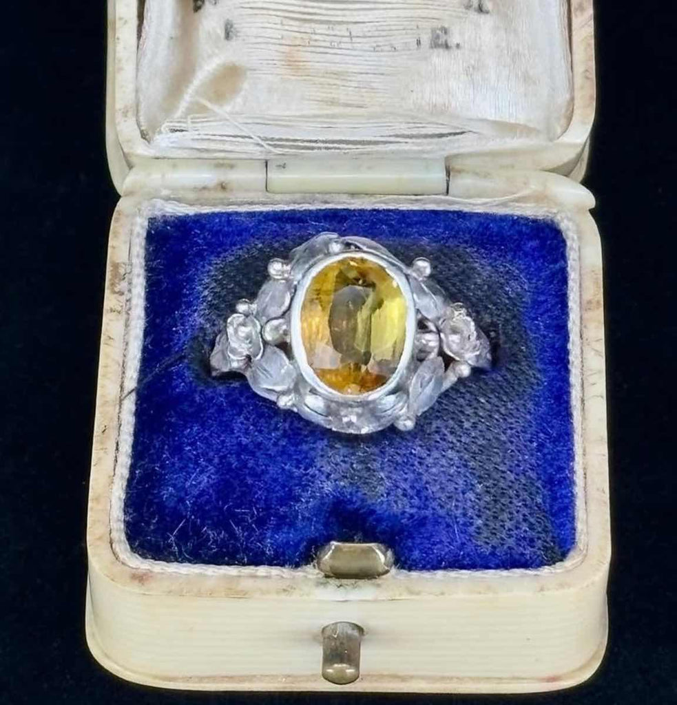 Vintage Rhoda Wager silver citrine ring with floral detailing, a classic piece from the 1930s.