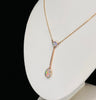 Solid crystal opal necklace from the Edwardian period, featuring vibrant opals and a fine link chain crafted in 9ct yellow gold.