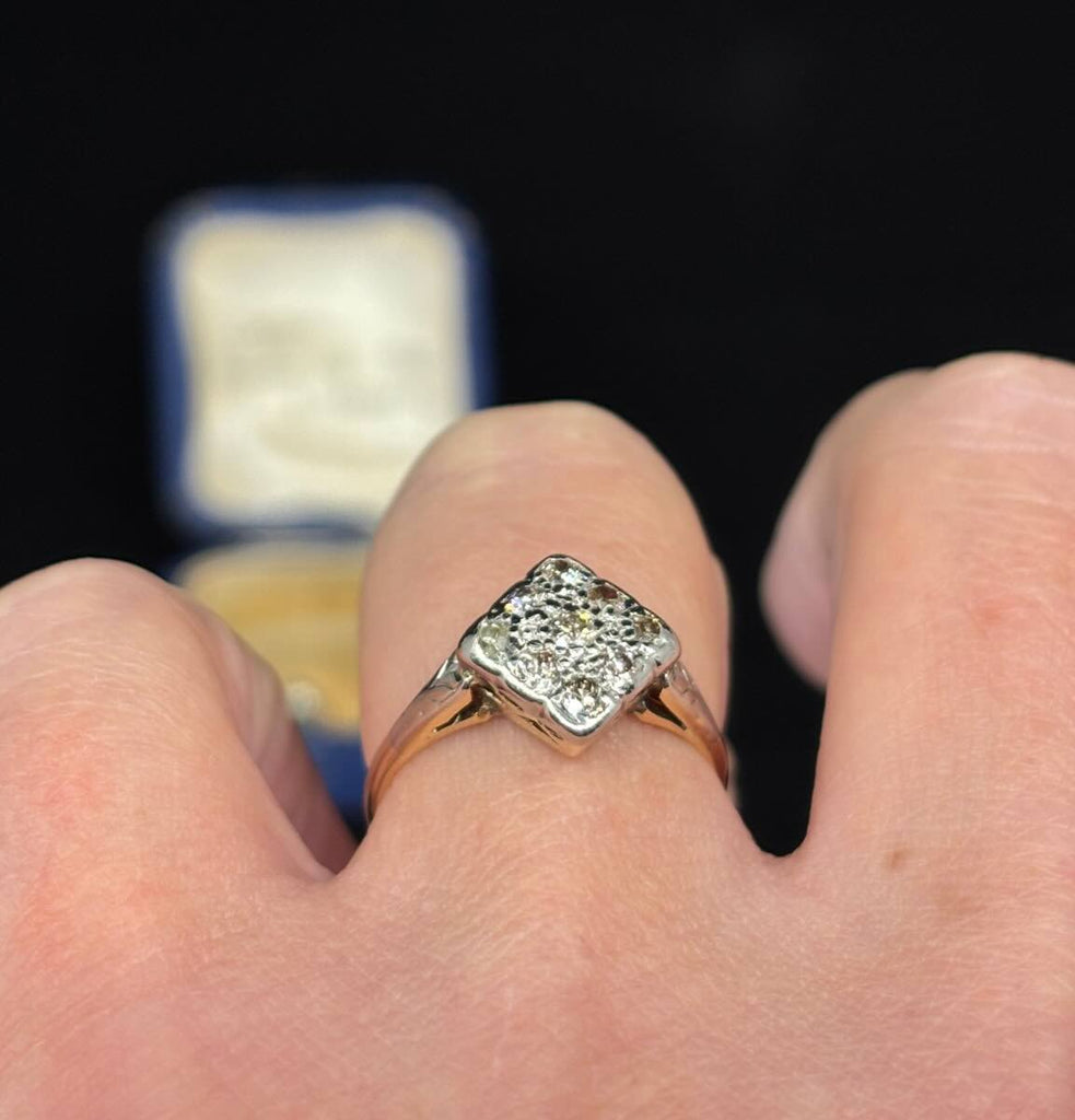 stunning Antique Diamond Cluster Ring, exemplifying the craftsmanship and beauty of vintage jewelry pieces.