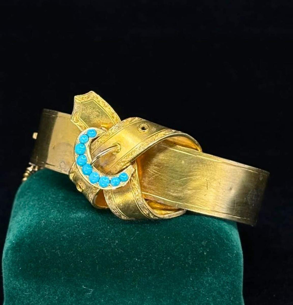 Detail of turquoise cabochon buckle motif on Victorian 15ct gold hinged bangle circa 1860