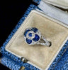 Unique art deco heirloom sapphire and diamond ring showcasing the side view with a flat profile to fit snug on the finger.