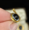 Pair of Antique Victorian 18ct yellow gold snake earrings with 8mm banded onyx cabochons, front view in antique velvet box.