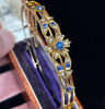 Victorian antique bangle 15ct gold set with round sapphires and 14 old-cut diamonds, circa 1895.