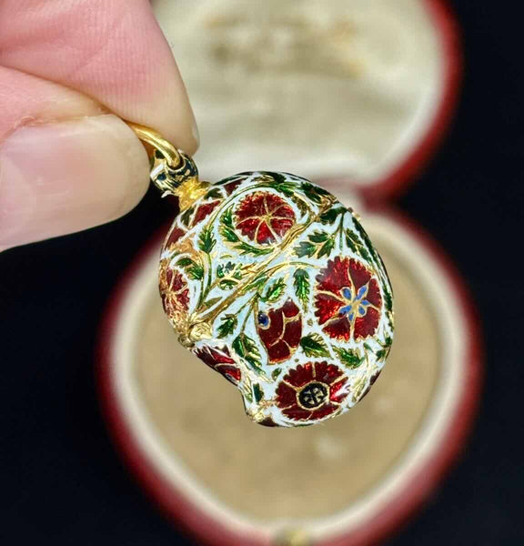 Victorian enamel pendant in 22ct yellow gold featuring ornate floral enamel and hinged pomander design.