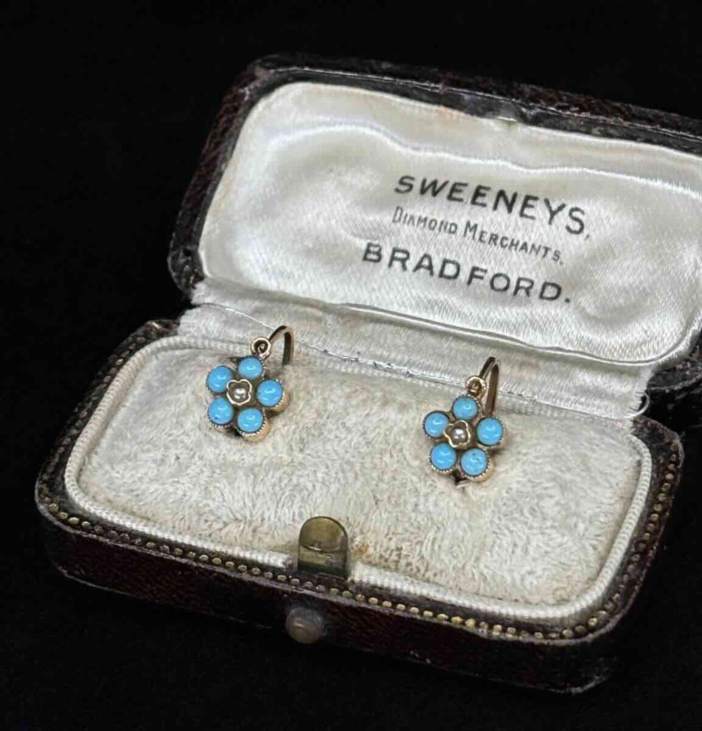 Victorian era Vienna daisy cluster earrings with turquoise cabochons and central pearls in 9ct gold.