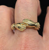 Victorian gold fede gimmel ring worn on finger showing scale and craftsmanship