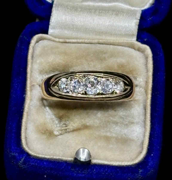 Victorian diamond ring in an antique blue velvet ring box.